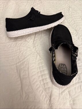 Hey Dude Black Slip-On Sneakers with White Speckled Sole